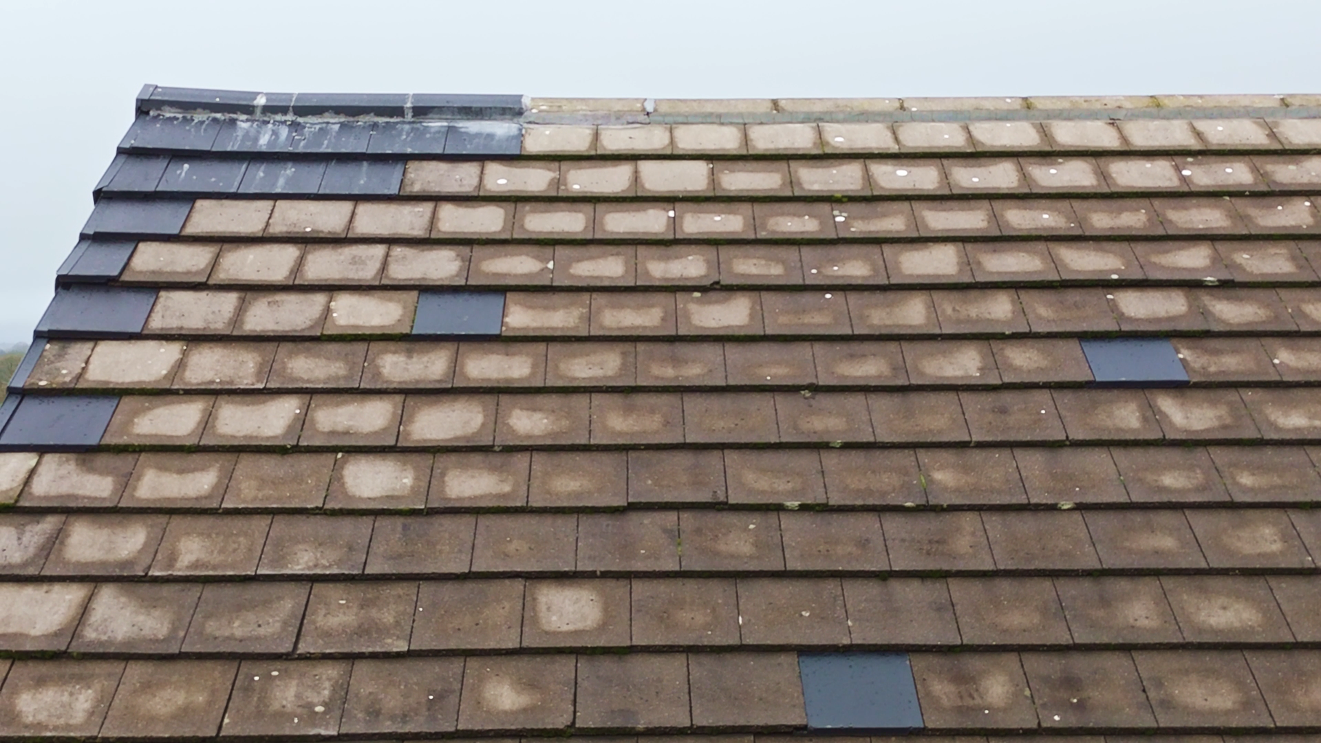 Close-up drone image of roof tiles and gutter detail